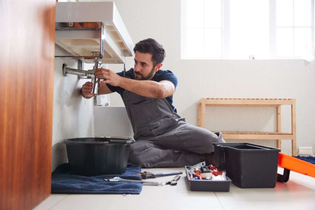 plumber under sink