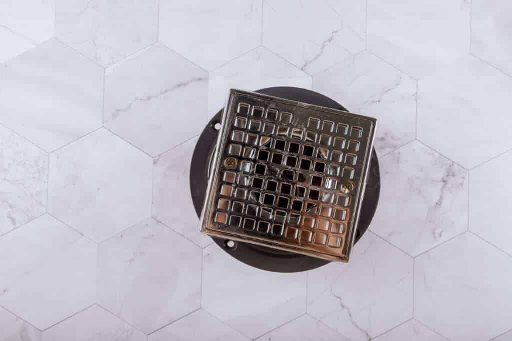 Floor drain from modern shower in cover is stainless steel, drain cover