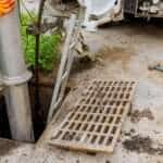 Sewage industrial cleaning truck clean blockage in a sewer line.