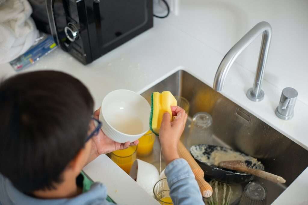 boy washing dishes