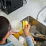 boy washing dishes